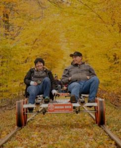 picture of a couple riding a rail bike